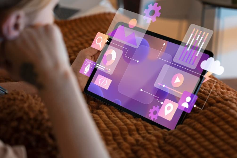 A person views a tablet screen displaying vibrant, interactive UI design elements